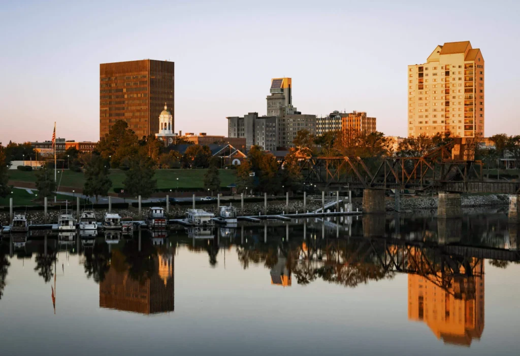 Augusta's skyline reflecting on the water during a serene afternoon.