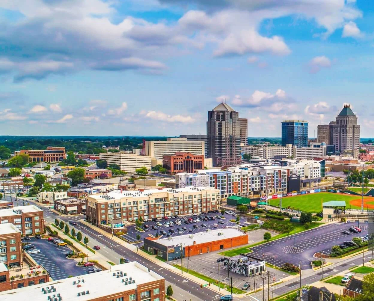 Aerial view of Greensboro, showcasing destinations for VOY’s luxury service.