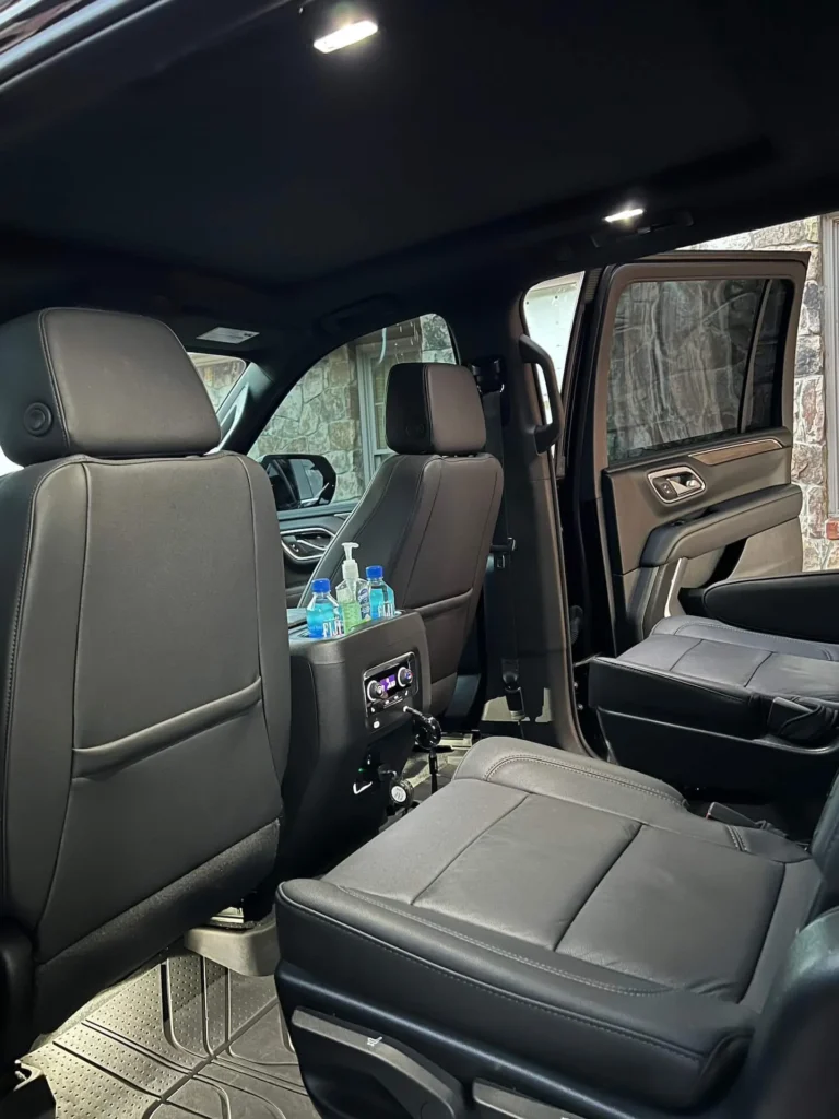 Luxurious SUV interior with amenities, ready for executive passengers.