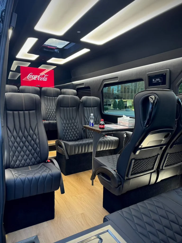 Luxurious van interior ready to transport executives in comfort.